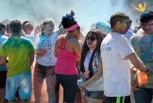 Students celebrate Holi on the CWRU campus with colorful powders.