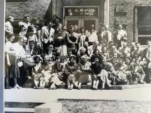 Group of Social work students smile for camera as a class