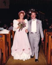 Couple walks down the aisle at their wedding