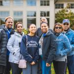 CWRU family smiles in front of camera