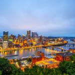 Pittsburgh skyline in the evening shown from an aerial perspective