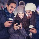 Three people staying warm in the winter
