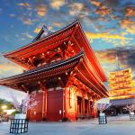A traditional Japanese building shown in the evening, illuminated
