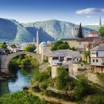 A panoramic view of a residential setting in Mostar, shown in the daytime