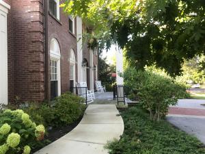 Rocking chairs on the front porch of the The Linsalata Alumni Center 