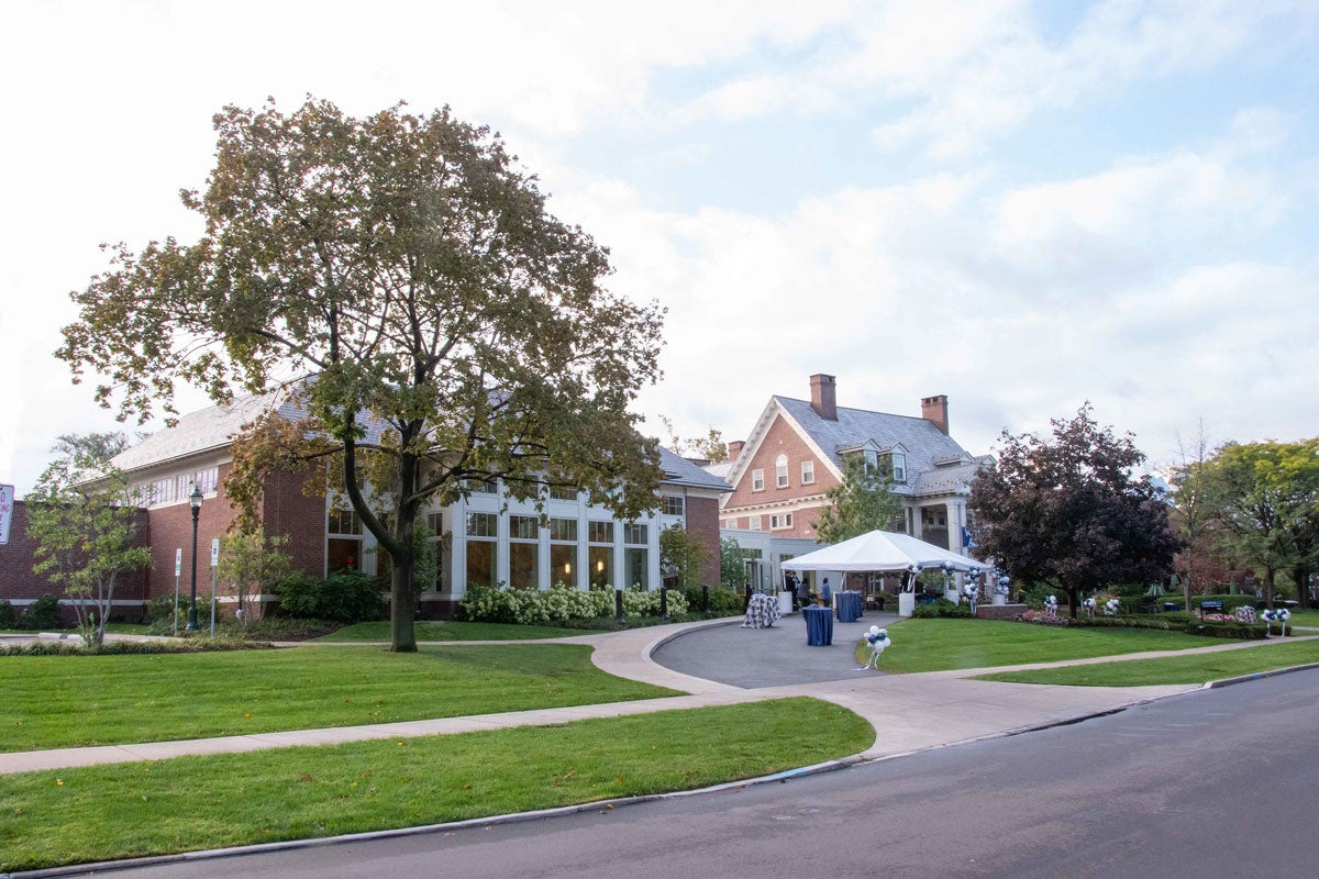 A tent and balloons set up outside of the Linsalata Alumni Center of Case Western Reserve University