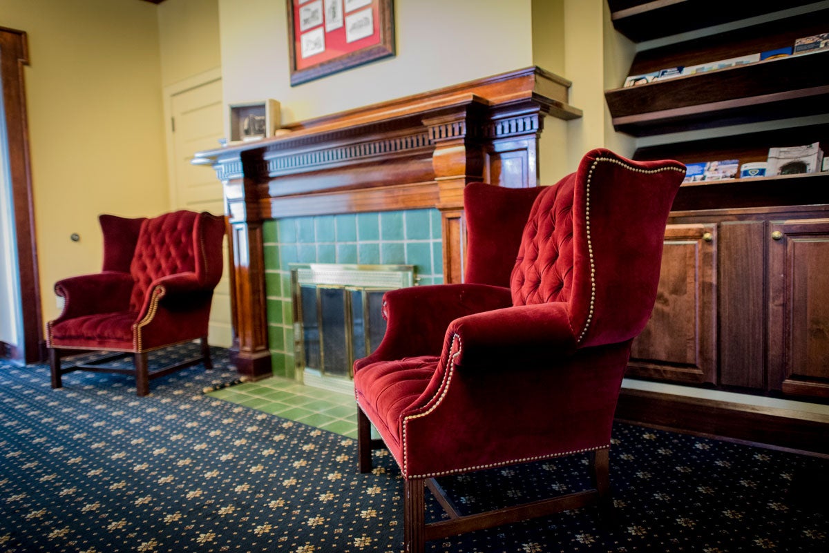 Red chairs in the lobby of Linsalata Alumni Center of Case Western Reserve University