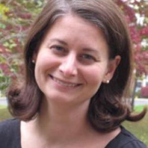 Color head shot of white women with shoulder length hair outside