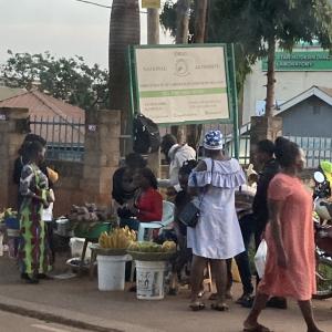 Image of crowd at a sidewalk produce market