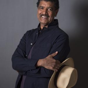Portrait of smiling man holding hat