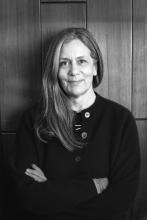 Black and White image of woman with long hair with arms crossed