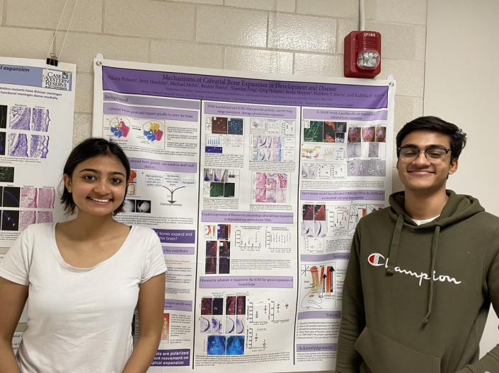 Nikaya Polsani, explaining her work to her brother before graduating