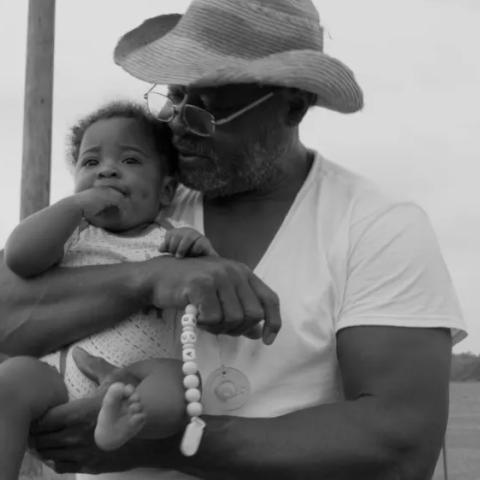 black and white picture of a man and baby