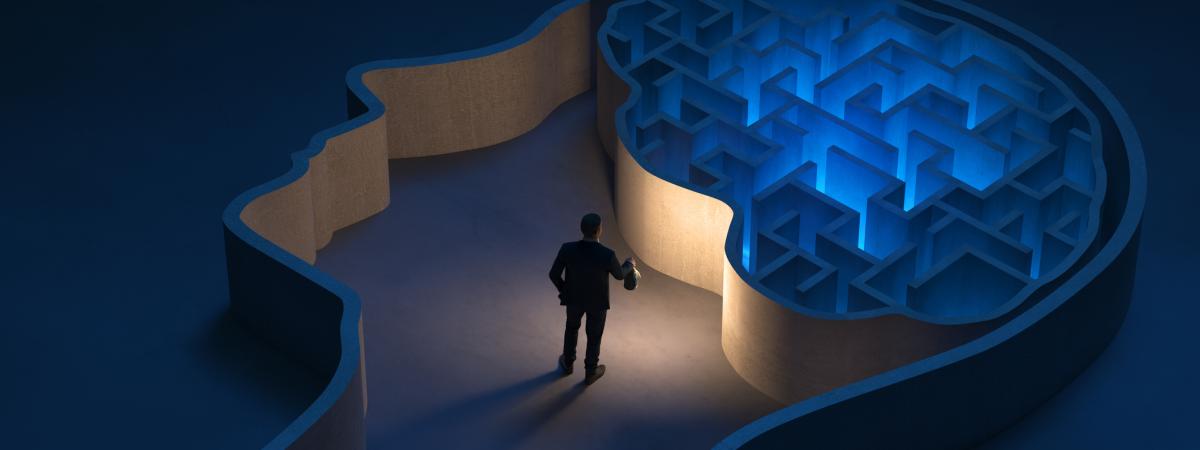 3D illustration of person holding a lantern inside of a maze shaped like a human brain