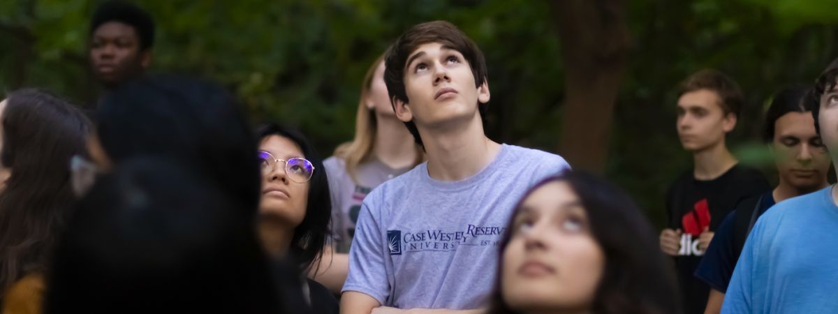 Students looking up at sky