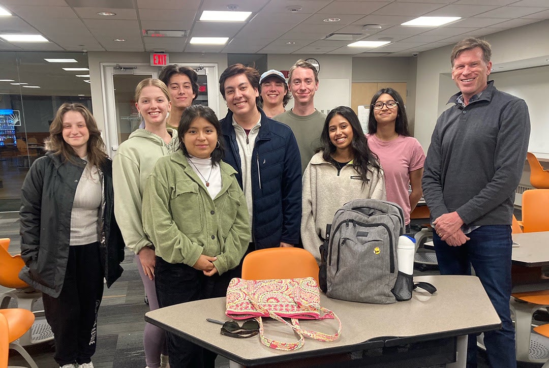 Tim Beal stands with the nine inaugural Mandel Fellows in the Experimental Humanities