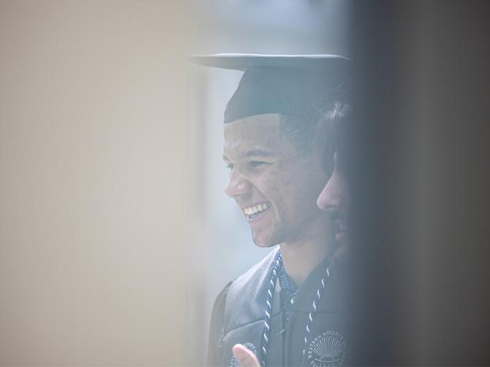 CWRU student in cap and gown