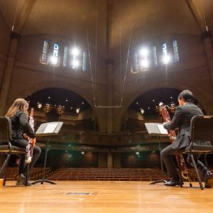 Woodwind students perform masked in the Maltz Performing Arts Center