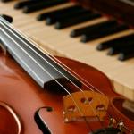 Photo of a string instrument and piano