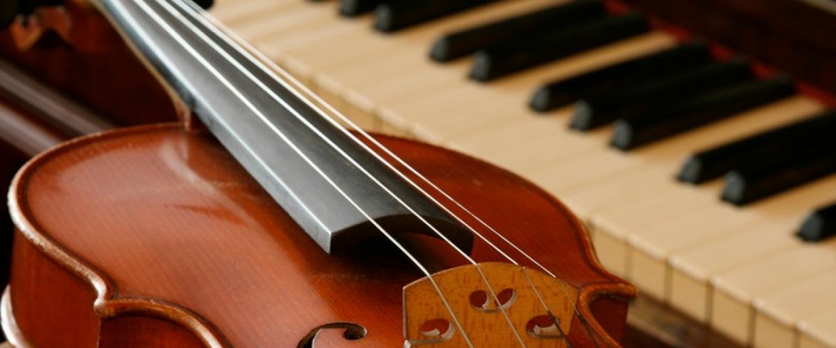 Photo of a string instrument and piano