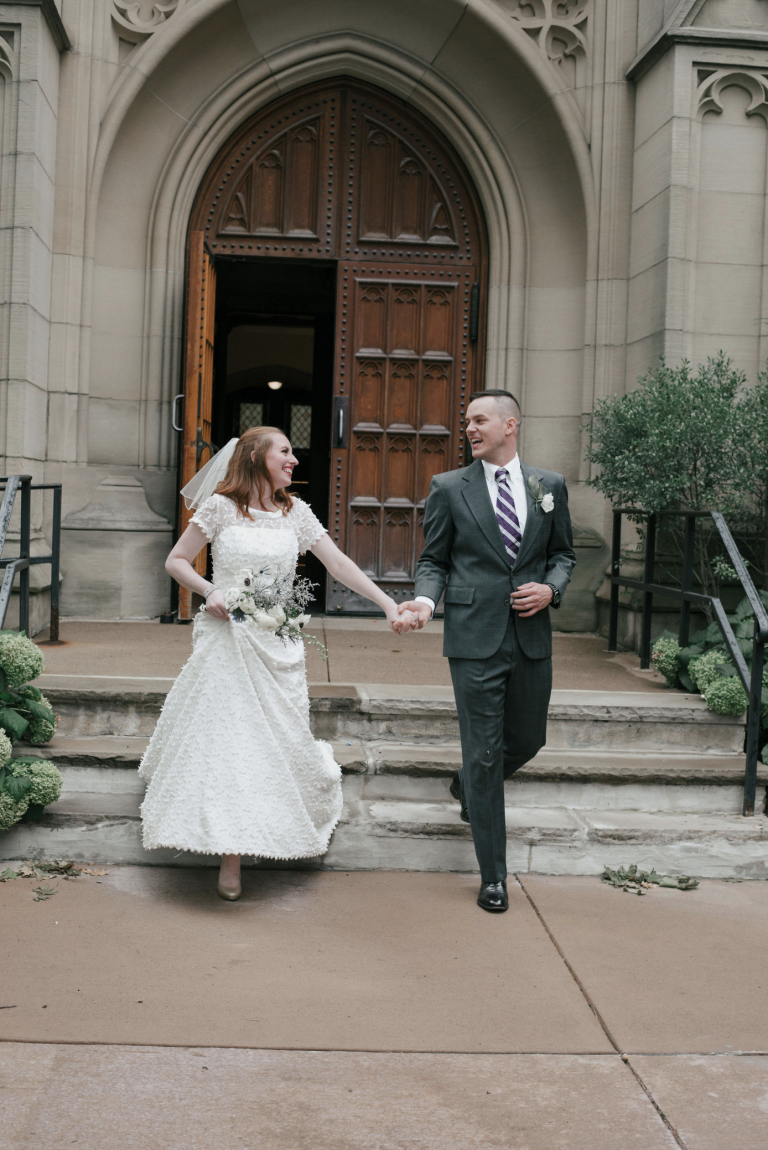 A happy couple exits harkness chapel after their wedding
