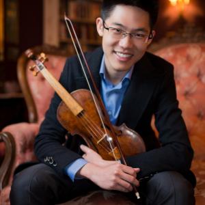 Portrait of Alan Choo holding his violin