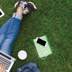 Image of school supplies in the grass