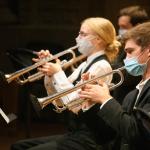 Trumpet players perform masked at the Maltz Performing Arts Center