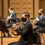 Symphonic Wind musicians play masked at the Maltz Performing Arts Center