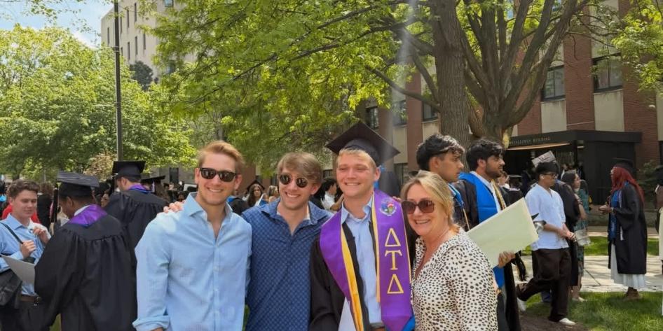 2026 Commencement, male graduate and guests