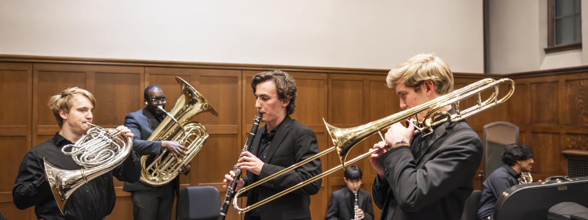 Students playing instruments backstage in Harkness Classroom.