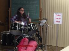Mandy Smith playing the drums