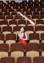 Jiana Peng Photo - woman in red dress sitting in Mixon Hall