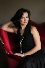 MTrojanowska Photo - woman with dark hair sitting on red chair