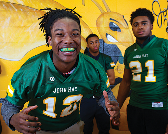 football player smiling with mouthguard on