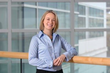 allison webel leaning against railing