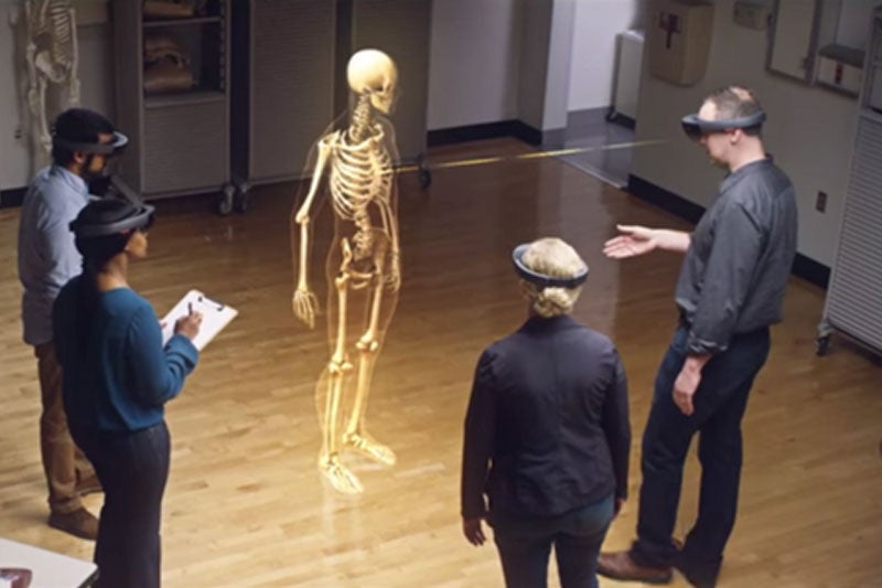 Students using the Hololens to view a human skeleton