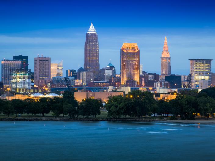 Cleveland, Ohio, skyline shown near the water in the evening hours