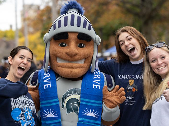 Spartie celebrating with students