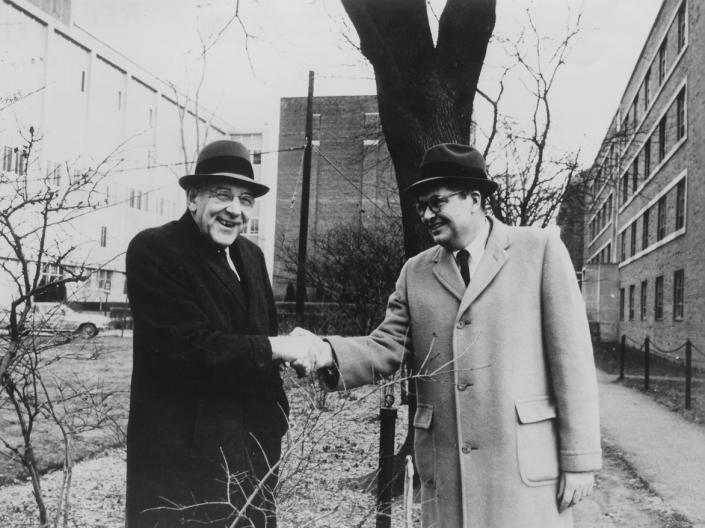 John Millis and Robert Morse shake hands