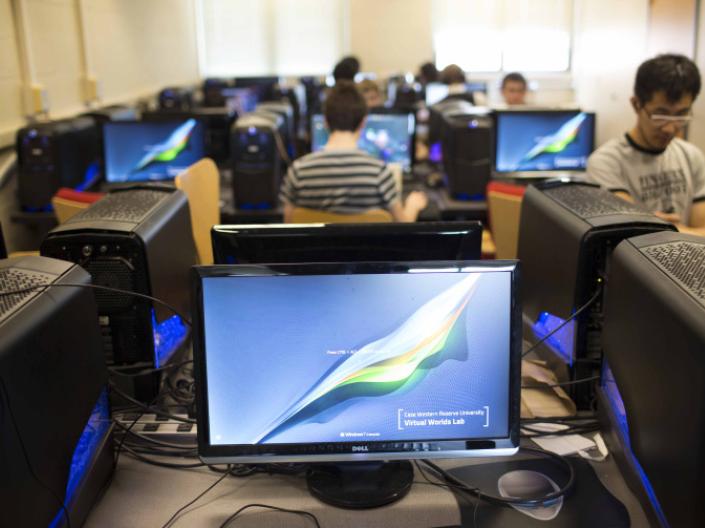 computer in gaming lab with students in the background