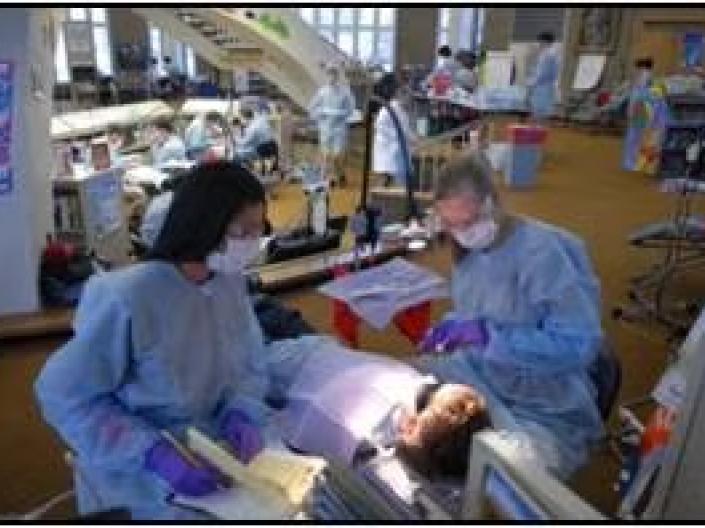 dental students work on patient