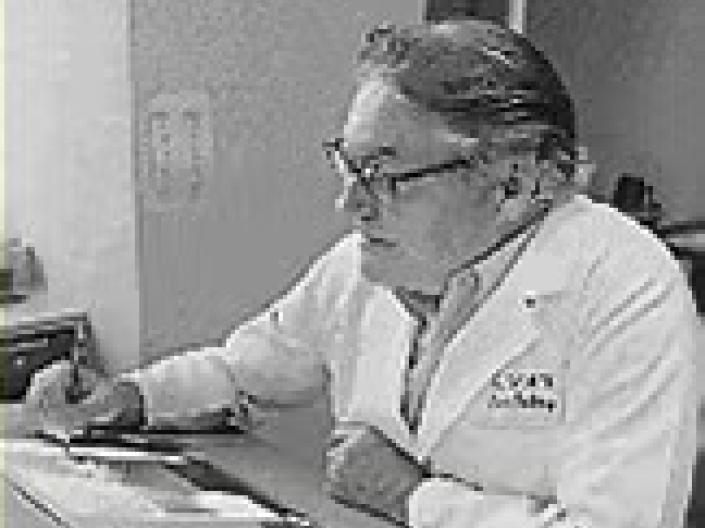 man looking at radiographs