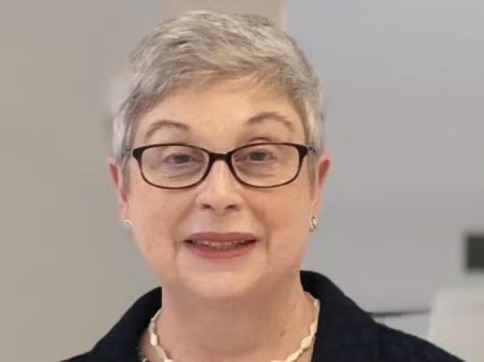 Elizabeth M. Tracy smiles at the camera