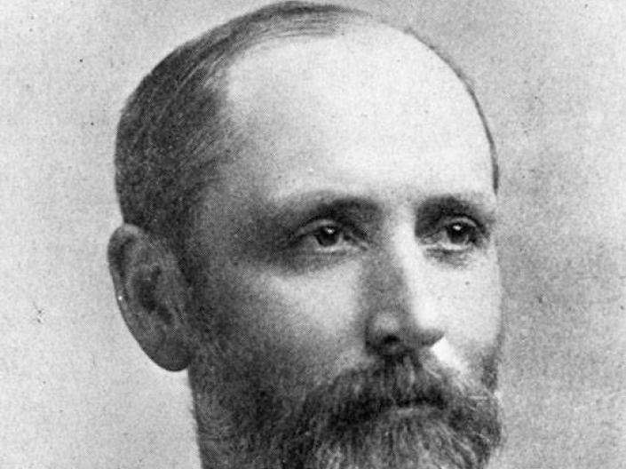 Portrait photograph of Clarence Emir Allen wearing formal attire, looking at the camera at an angle