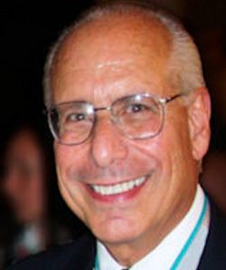Image of headshot of Arnold Caplan