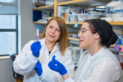 Agata Exner, left, and Salima El Yakhlifi, a former postdoctoral scholar in the Exner Lab look at a specimen