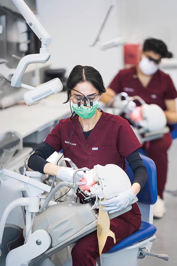 School of Dental Medicine students working on simulated dental exams