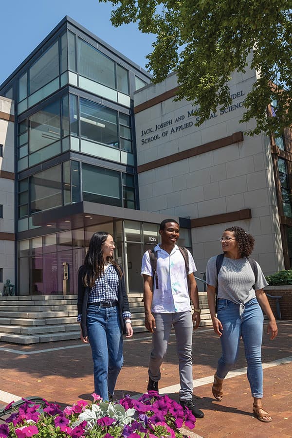 Students talking in front of Jack, Joseph and Morton Mandel School of Applied Social Sciences building