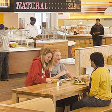 Students in dining area eating,